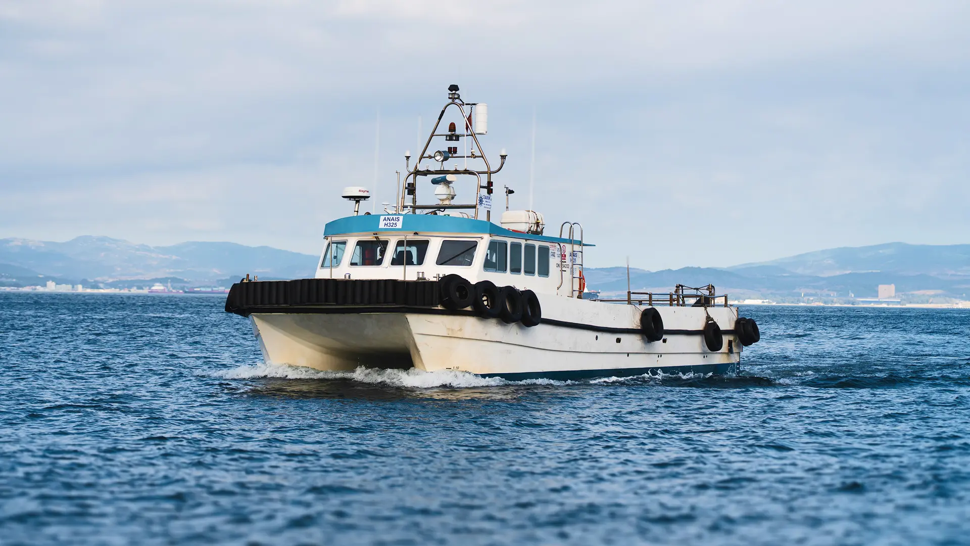 Tarik catamaran workboat at sea