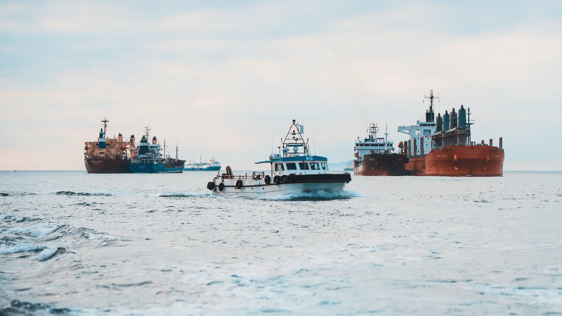 Tarik workboat among vessels at anchor