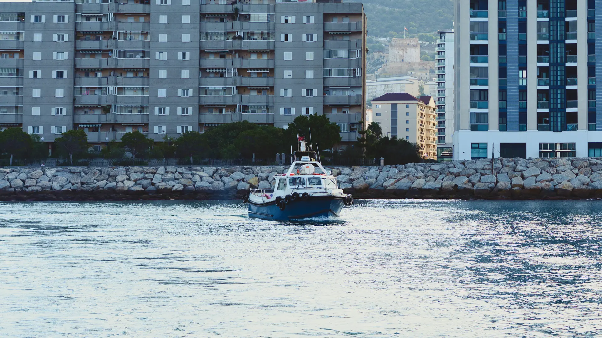 Tarik workboat passing Gibraltar's waterfront